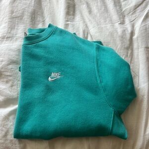 Turquoise Nike crew neck. Worn once size medium
